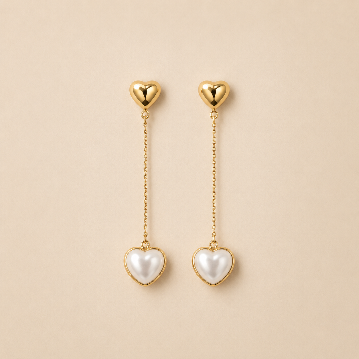 Aretes Doble Corazón Lisette Dorados